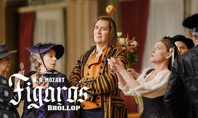 Figaro omgiven och en kvinna som jonglerar med ett äpple